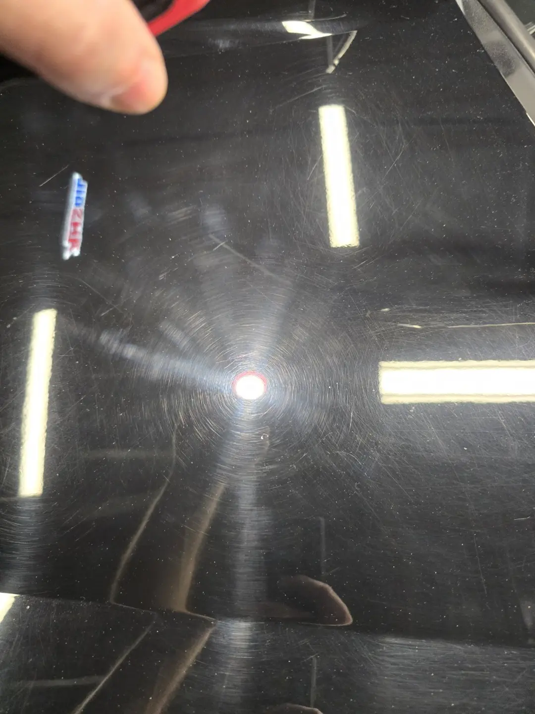Heavy wash marring on a black Thunderbird before paint correction
